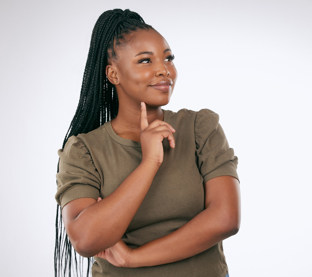 Thinking, decision and black woman in studio for ideas, mindset or planning on mockup. Inspiration, brainstorm and female model curious of question, solution and remember a memory, strategy or vision