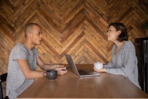 business partners talking on kitchen table