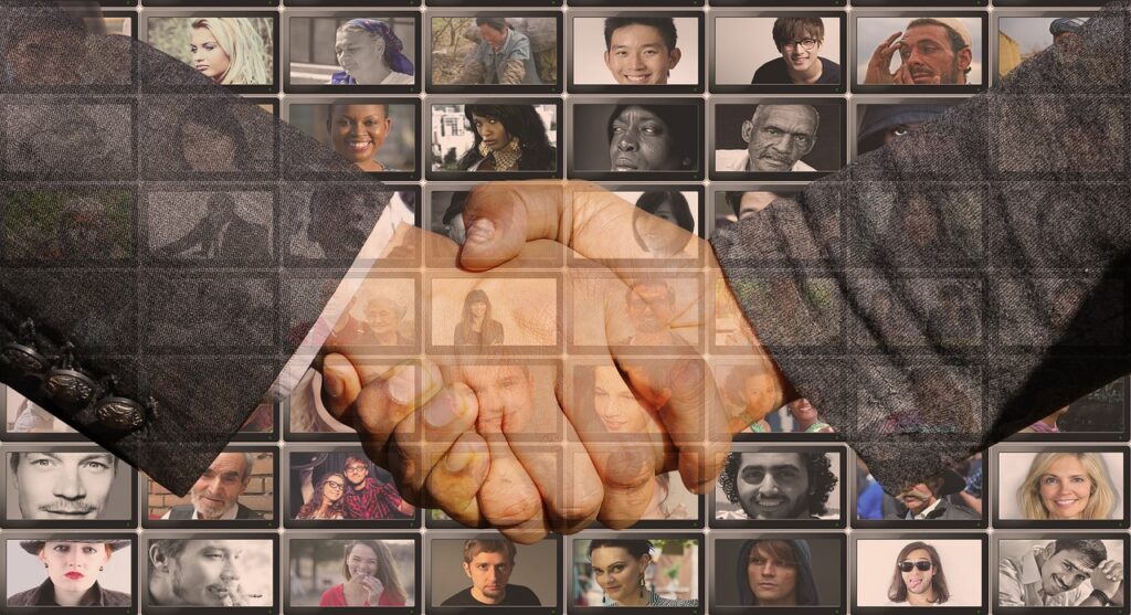 Handshake Shaking with on screen people in the background