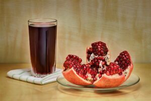 pomegranate with a glass of juice