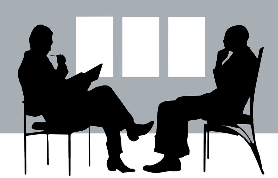 illustration of two people sitting in chairs