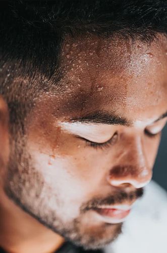 A Close-up Picture of a Man with Profuse Sweating On his Face.