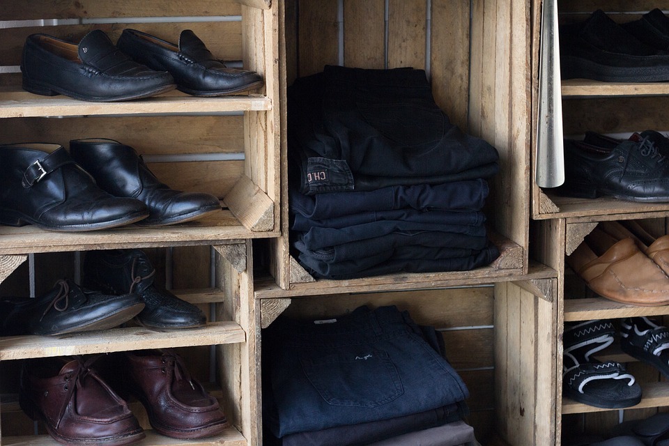 wooden divider, black shoes, black pants