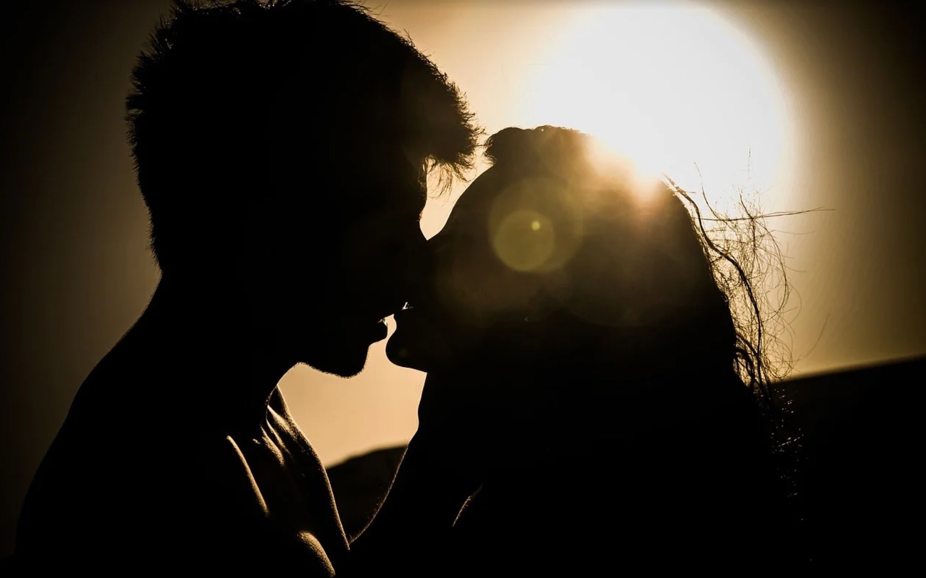 man woman kissing